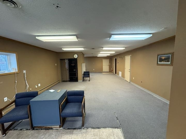 Suite A large open interior space viewed from the front entrance